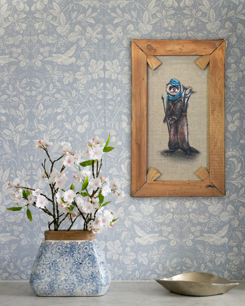 Painting on wall of ferret with a spear and catch of herring by Jenny Holmlund