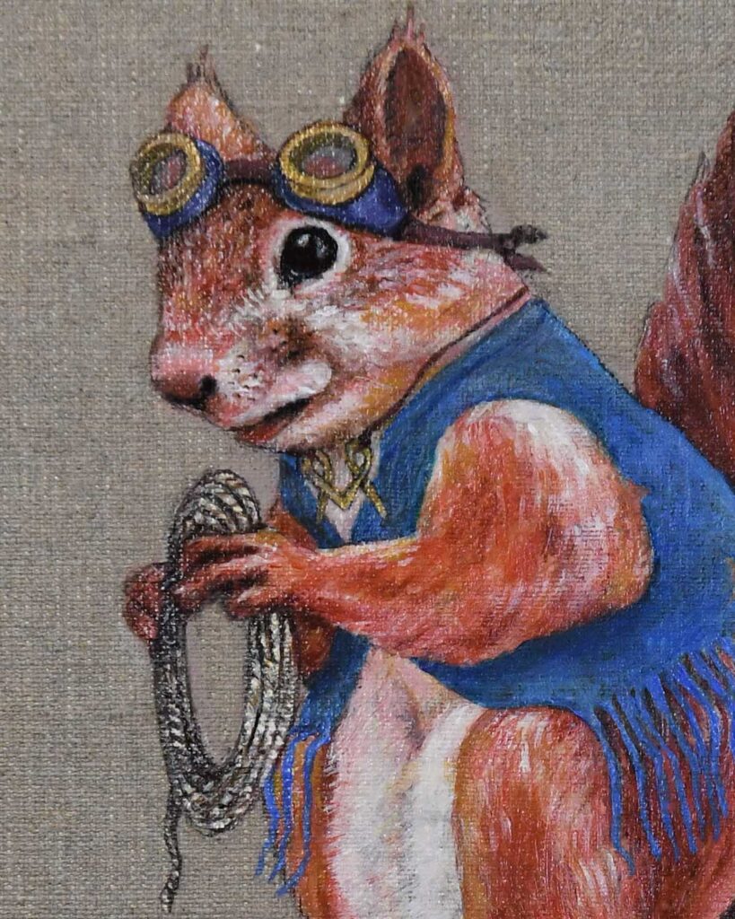 close up of Squirrel in blue vest holding a rope by Jenny Holmlund		